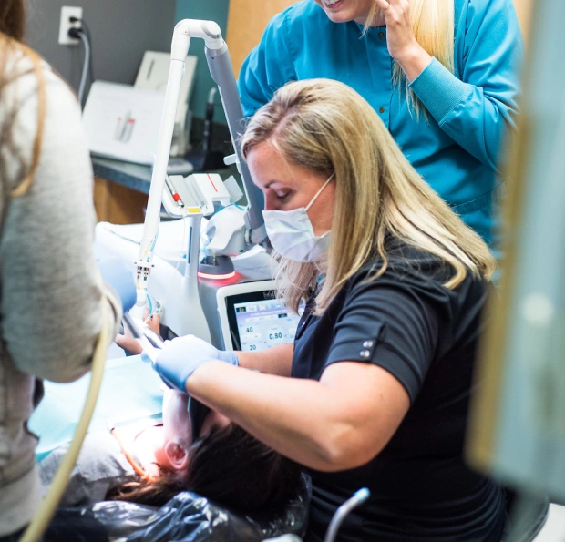 Dentist providing emergency dental treatment