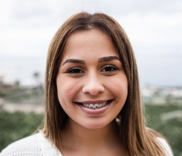 Woman smiling with orthodontic braces