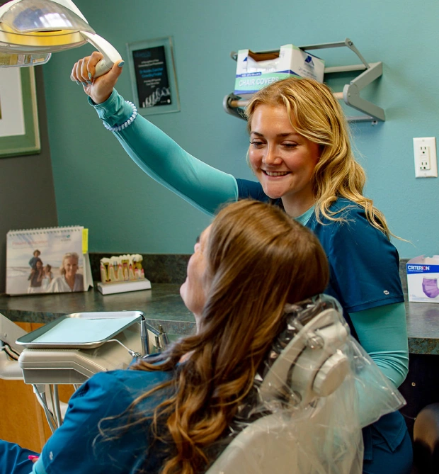 Dentist providing root canal treatment to a patient