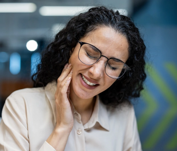 Woman receiving treatment for TMJ discomfort
