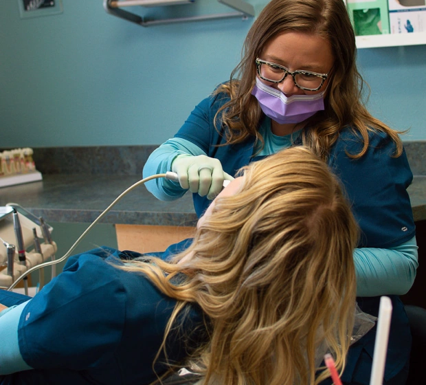Dentist performing a tooth extraction procedure